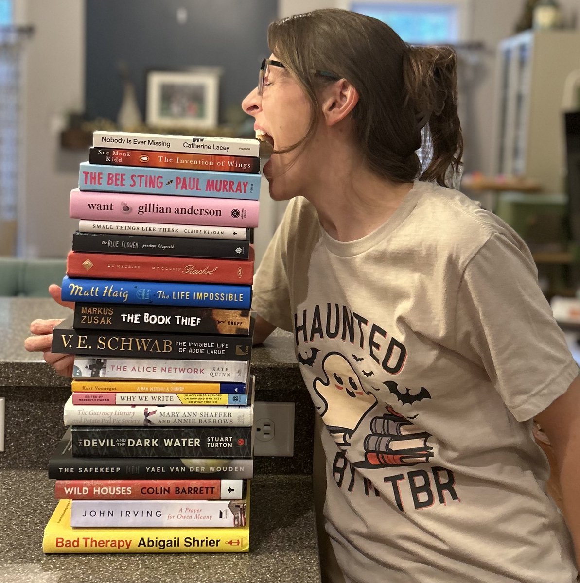 bowerspartyof5's tweet photo. Hi I’m Heather. If you didn’t already know that I’m kind of a goof, here’s this. A photo shoot with my new shirt and unread books. 😆 #tbr #books #whichonefirst https://t.co/HCJ4E4sEqe