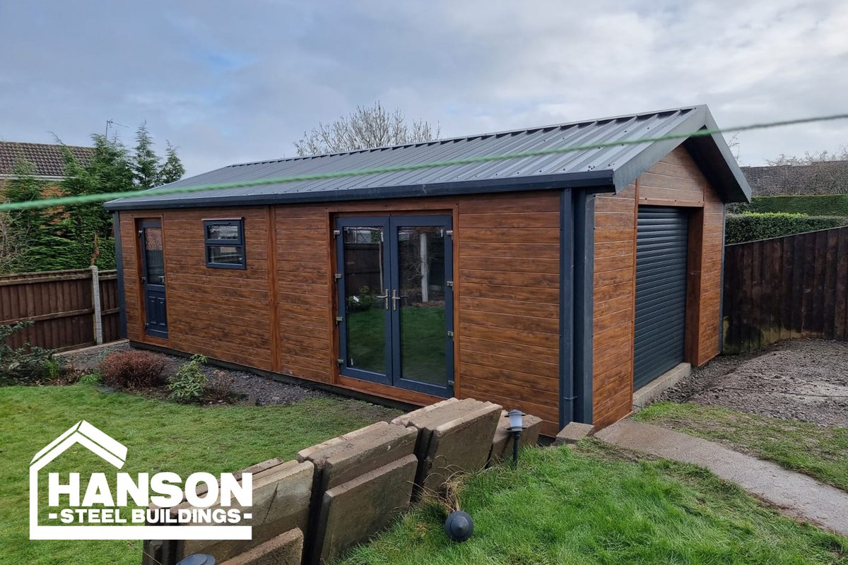 Hansonbuildings's tweet photo. Our customer's garden just got an upgrade with a new steel garage  featuring our Gold 80mm insulation. The 300mm Roof canopy and Anthracite French doors add the perfect touch to a practical space 📷
#hansonsteelbuildings #steelbuildings #steelconstruction #bespoke #gardengoals https://t.co/h9kDjKKQYX