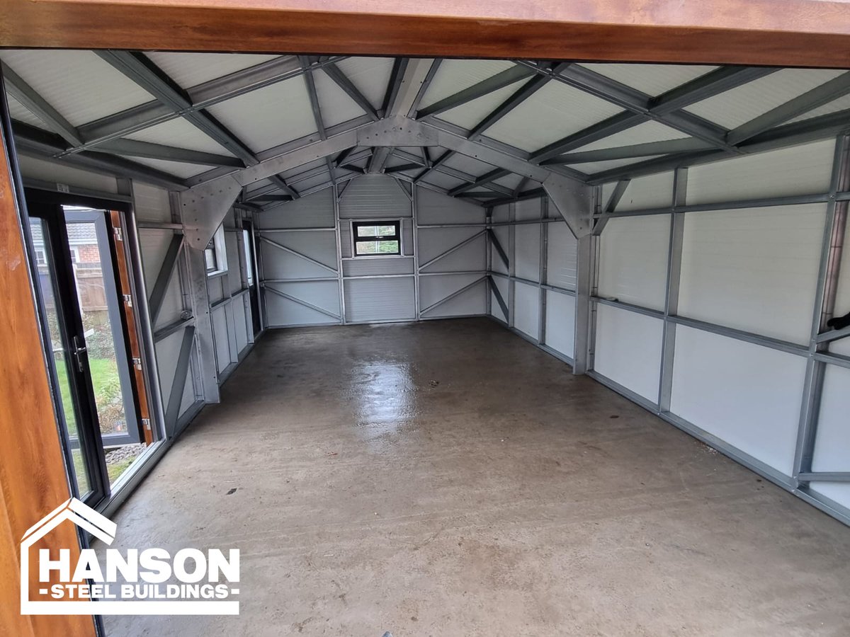Hansonbuildings's tweet photo. Our customer's garden just got an upgrade with a new steel garage  featuring our Gold 80mm insulation. The 300mm Roof canopy and Anthracite French doors add the perfect touch to a practical space 📷
#hansonsteelbuildings #steelbuildings #steelconstruction #bespoke #gardengoals https://t.co/h9kDjKKQYX