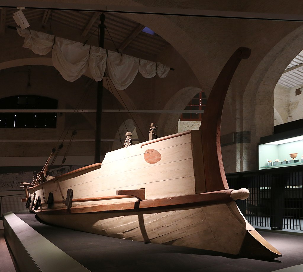 The Alkedo shipwreck, 1st century AD, discovered in Pisa. This wreck is so well preserved we even know what  the name of the ship likely was: in a tablet nailed to one of the rowers' benches the name ALK(E)DO (seagull) can in fact be read. It was painted, as shown in the replica.