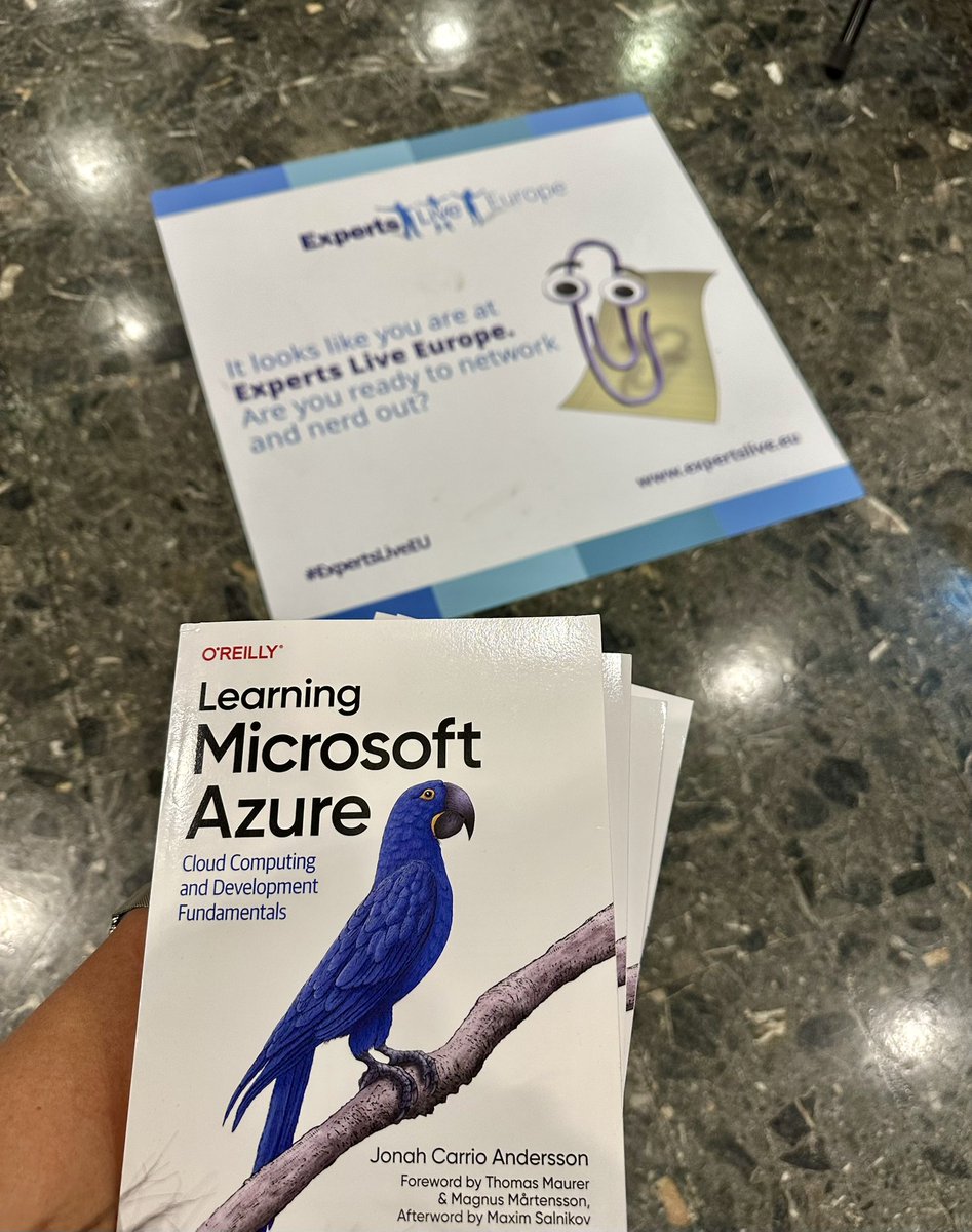 cjkodare's tweet photo. The Azure blue bird on book and #Clippy found each other at #ExpertsLiveEU https://t.co/hMgepushoa