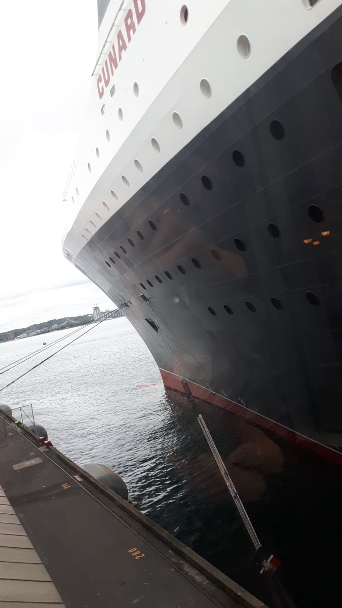 RMS Queen Mary 2 is in Halifax today. The historic "Doctor's Window" at the Canadian Museum of Immigration at Pier 21, where I work, has a great close-up view of this legendary Cunard liner. Love the rat guards on the mooring lines with paint schemes that matche QM2's hull!