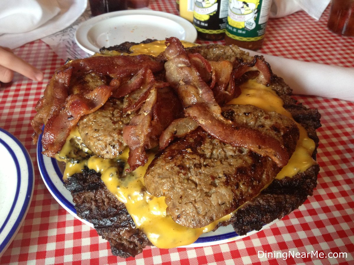 How about burgers with sausage, bacon and cheese? Forks and knives instead of hamburger buns.