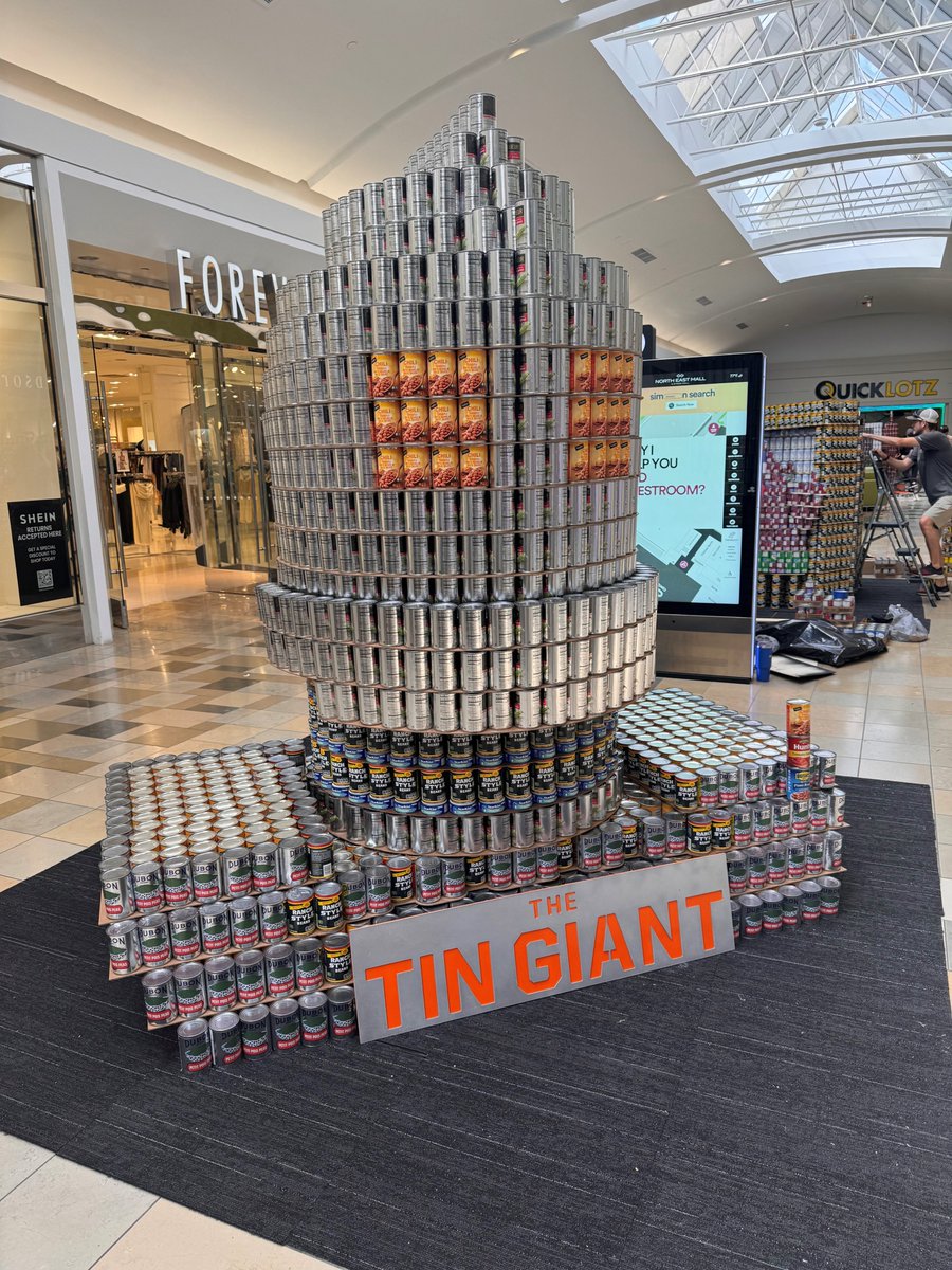 VLKArchitects's tweet photo. The VLK Fort Worth office had a blast competing in this year’s CANstruction Fort Worth event! Celebrating 25 years, the theme was “Let’s End Hunger Like It’s 1999,” and our team partnered with RWB to create The TIN Giant. #VLKArchitects #CANstruction https://t.co/UfT8Xoou41