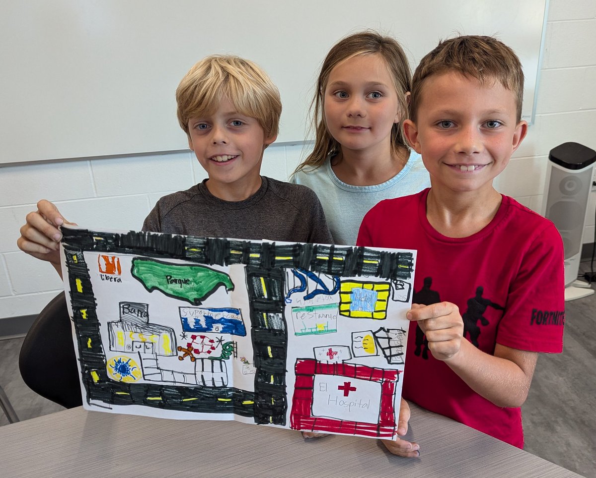 3rd grade Spanish students show off the town map they created together. <a href="/IHElementary/">IHElementary</a> #ihPromise