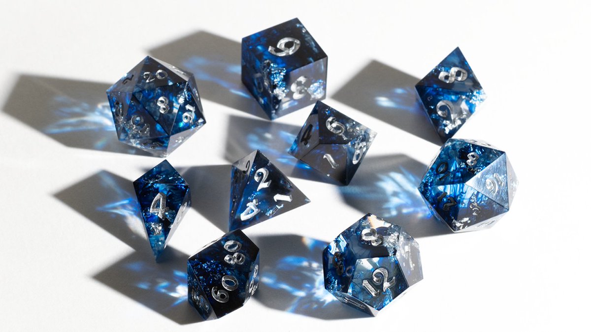 AstralDiceShop's tweet photo. Glacial Grace
Frigid deep blue waters with silver icy flakes throughout. The way the light shines through these dice is just magical. This is the final set for sale tomorrow at 12PM MDT! Hope to see you there! π
#dice #dnddice #dnd #ttrpg #ttrpgdice #Halone #ffxiv https://t.co/tGVHMyK9Hr