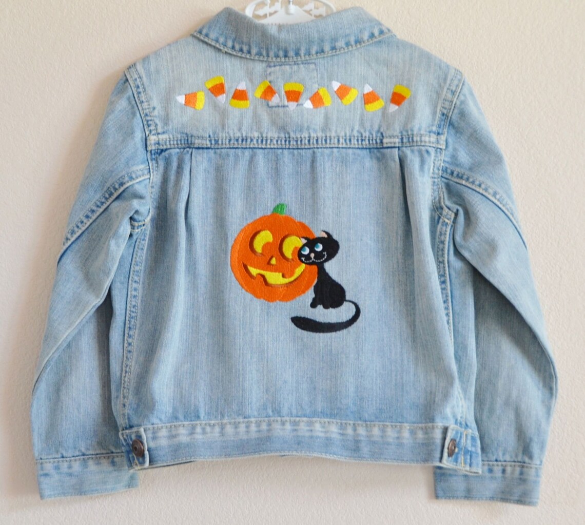 Halloween Jack-O’-Lantern and Cat Denim Jacket

etsy.me/3zGsidF via <a href="/Etsy/">Etsy</a> #jacket #denim #halloween #jackolantern #cat #candycorn #embroidery #holiday #clothing #girls #boys #children #outerwear #coat #blue #orange #yellow #white #black #blue #gray #fashion #trickortreat