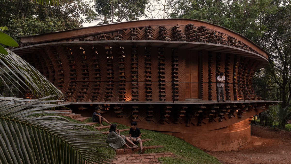 dezeen's tweet photo. Wallmakers wraps Indian home with perforated walls made with discarded toys: https://t.co/MOrLyGHtaA https://t.co/uNstIYtXj6