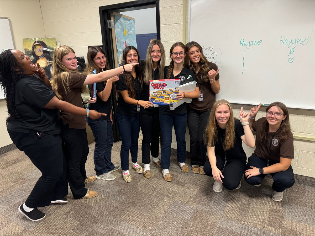 Students in Italian class had fun playing 'Indovina Chi?', better known as ‘Guess Who?’, to review nouns and adjectives needed used in physical descriptions. Le ragazze hanno vinto! The first semester of Italian III is designed to help students consolidate the basics of Italian