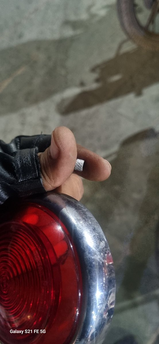 Amitesh87's tweet photo. @royalenfield @sidlal You claim your bikes made like a gun and this is how your gun is ripping apart on its own. While riding my meteor 350 the cap of its tail light came off on its own along with the screw collar. And on top of that your company has rejected the warranty claim. https://t.co/pBRl6c0pbl