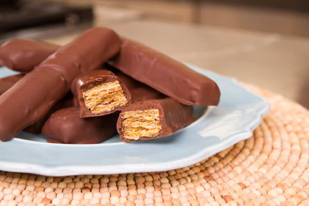 This candy bar says its  "crispety, crunchety, peanut-buttery?" What is its name?