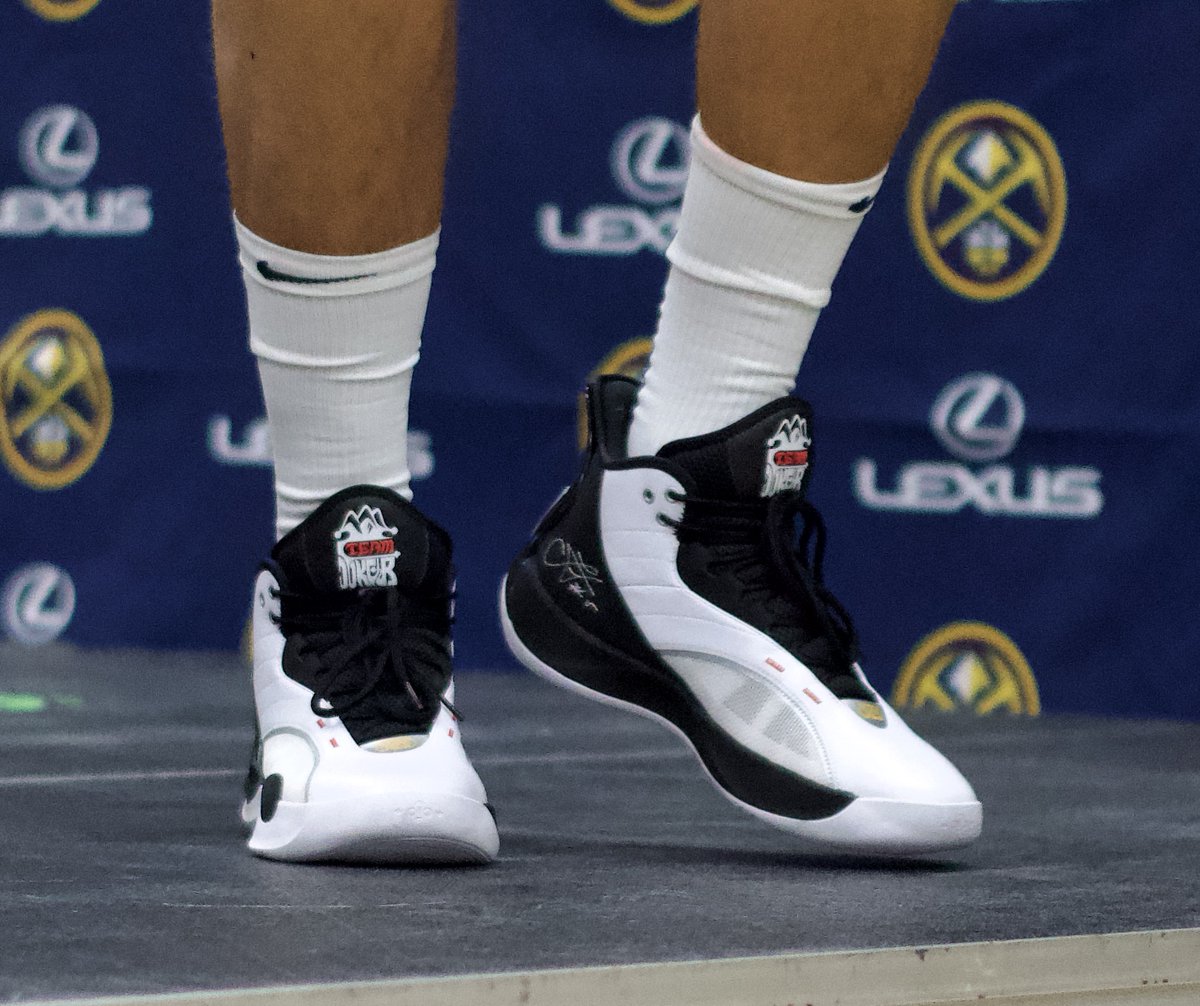 RyanGreeneDNVR's tweet photo. Jokic at media day in a shoe I haven't seen before, has his signature on it and "Team Joker" on the tongue. 👟👟 https://t.co/MluQcvJAjf