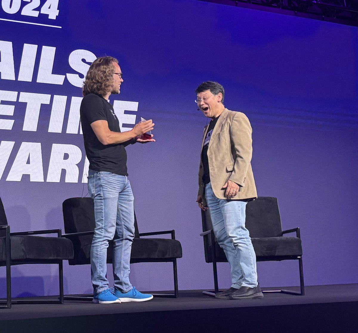 tapster's tweet photo. Loved this moment with @dhh surprising @yukihiro_matz with a #Rails Lifetime award at #railsworld #ruby #rails #rubyfriends https://t.co/I4YI3UII8R