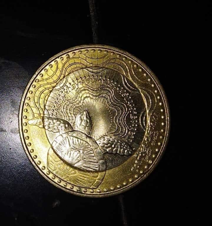Que linda es la moneda de mil pesos colombianos 💚