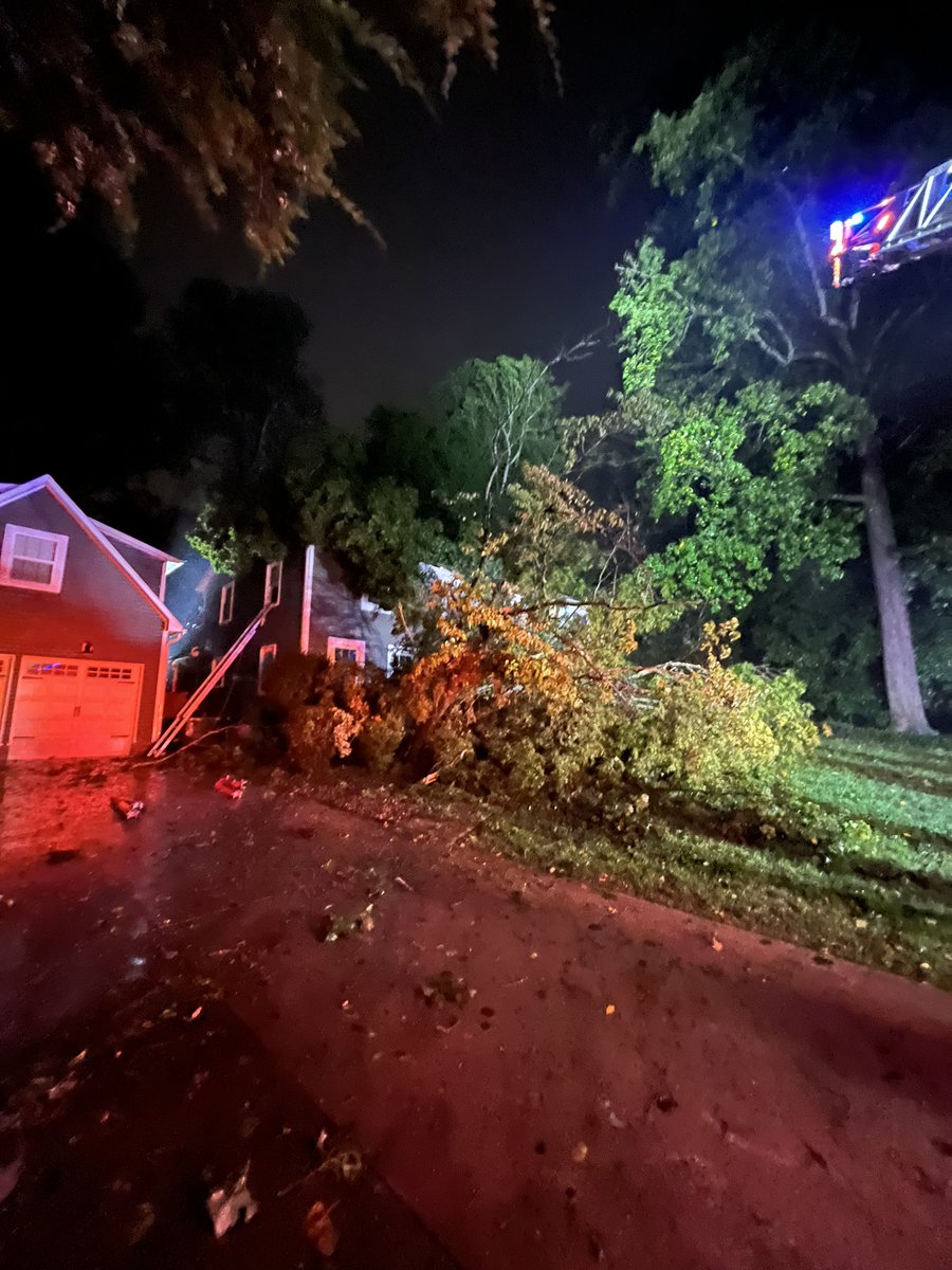 TREE DOWN: Deputies are assisting firefighters with rescuing 2 people trapped inside this house on Poinsett Dr. Rock Hill  where a huge tree fell on it just around 6 am. #YCSONews