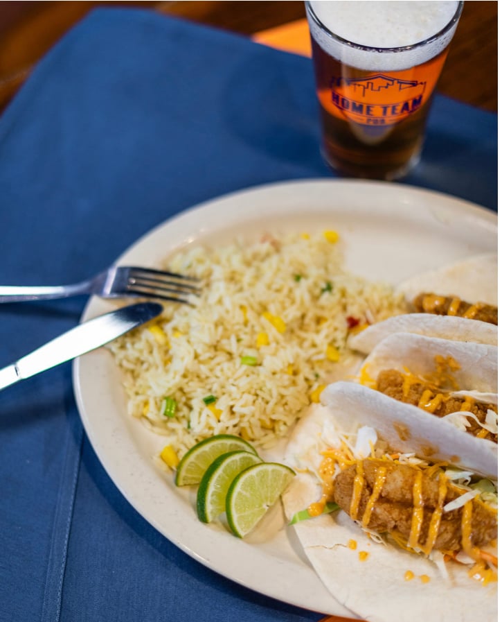 Craving a fresh and flavorful dish? Try our mouthwatering Fish Taco at Home Team Pub! 🍴 Made with fried white fish, cilantro slaw, cheddar jack cheese, and our homemade bistro sauce. You get three 6 inch tacos in one order. Don't miss out! #FishTaco #FreshFlavors #HomeTeamPub 🍻