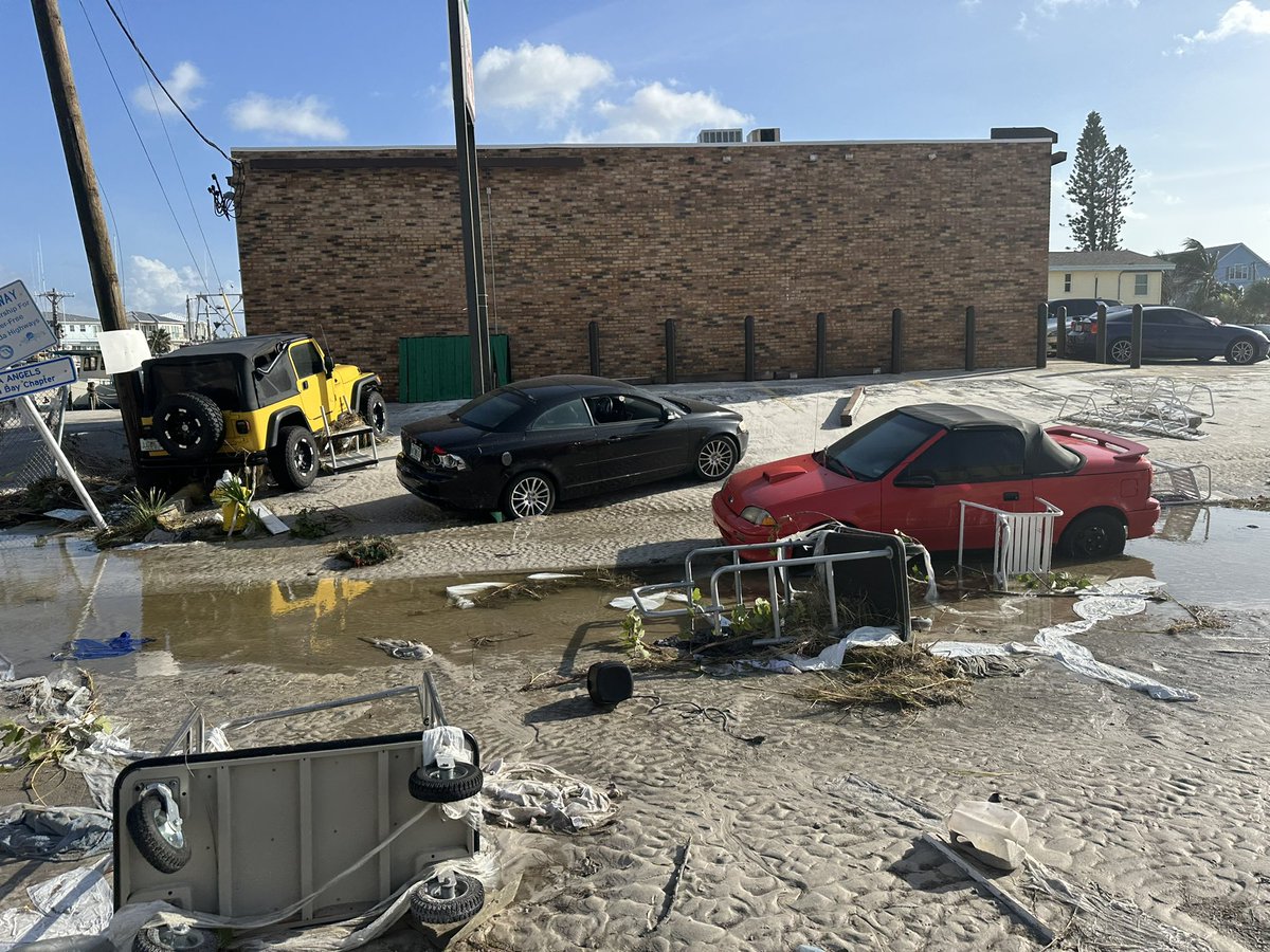 SheriffPinellas's tweet photo. Sights from Madeira Beach. Debris, displaced cars, burst pipes. It is almost unrecognizable. #PinellasHelene https://t.co/8wDqZ5kzZd
