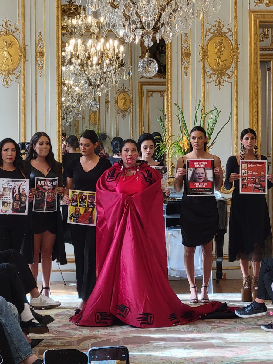 CanEmbFrance's tweet photo. Red dresses were featured as a conclusion of the #IIFW show – a symbol of #RedDressDay, which commemorates the missing and murdered #Indigenous women. #MMIWG2S #MMIW https://t.co/ruvpgWvkMp