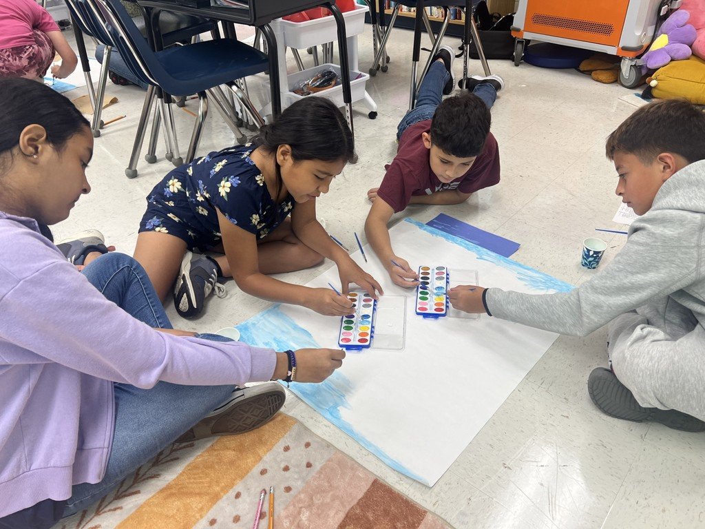 MarleyESAACPS's tweet photo. Mrs. Locher's 5th-grade class is working collaboratively on their ecosystem project today! 
 They are actively engaged in meaningful learning to create a background for their food web! #belonggrowsucceed #growingingreatness #aacpsawesome https://t.co/JW1naMAESx