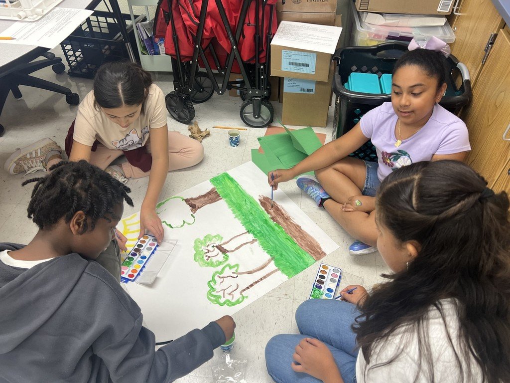MarleyESAACPS's tweet photo. Mrs. Locher's 5th-grade class is working collaboratively on their ecosystem project today! 
 They are actively engaged in meaningful learning to create a background for their food web! #belonggrowsucceed #growingingreatness #aacpsawesome https://t.co/JW1naMAESx