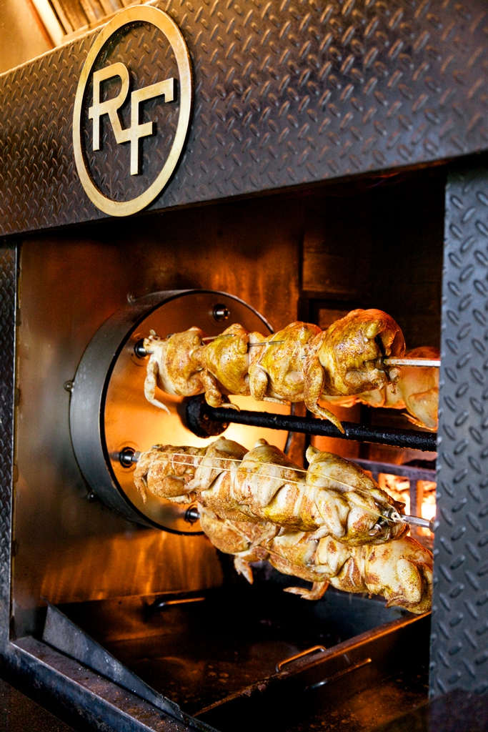 Hot 🔥 off the rotisserie!  Try our Chicken served with cornbread stuffing, brussels sprouts, &amp; lemon garlic jus