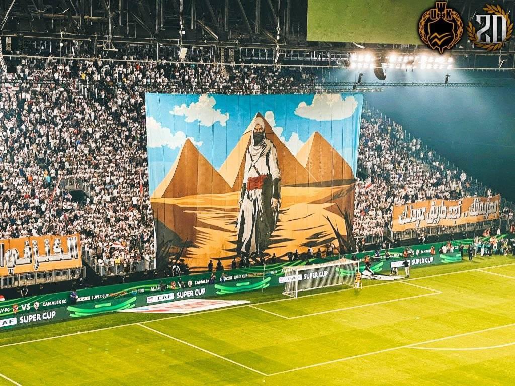بروح التالتة يمين وزئير الفرسان الزمالك ملك قارة وسيد أفريقيا

لأرضية الملعب والمدرجات حاكم واحد واليوم كالمعتاد أردنا أن نلقي عليكم بعض الدروس على أمل أن تتعلموا شيئًا.

وأن تتذكروا أن هذه المنافسة محسومة برعاية مدرسة التشجيع الأولى في القارة الإفريقية.

كان معكم ملك اللعبة 🤍🏹