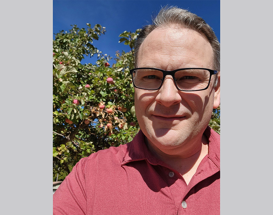 ShortLineSafety's tweet photo. Ryan is pondering rail safety under an apple tree, but you don't need Newton's knowledge of physics to know cars will lose vs trains. #STOPTrackTragedies by obeying signs/signals at rail crossings. And, of course, our mgr of program support is in red for #ST3Week &amp; @olinational! https://t.co/IW2Ii0SVTP