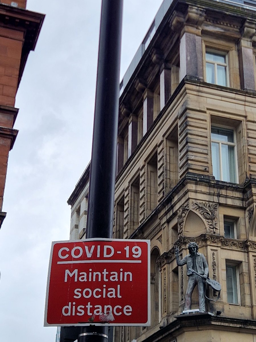 Lingering covid signage and John Lennon - Liverpool