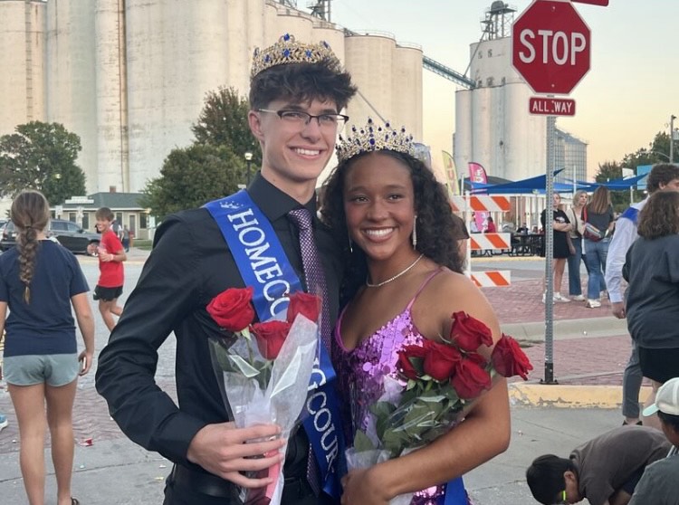 Small town Iowa is crowning your homecoming king and queen in front of a grain elevator