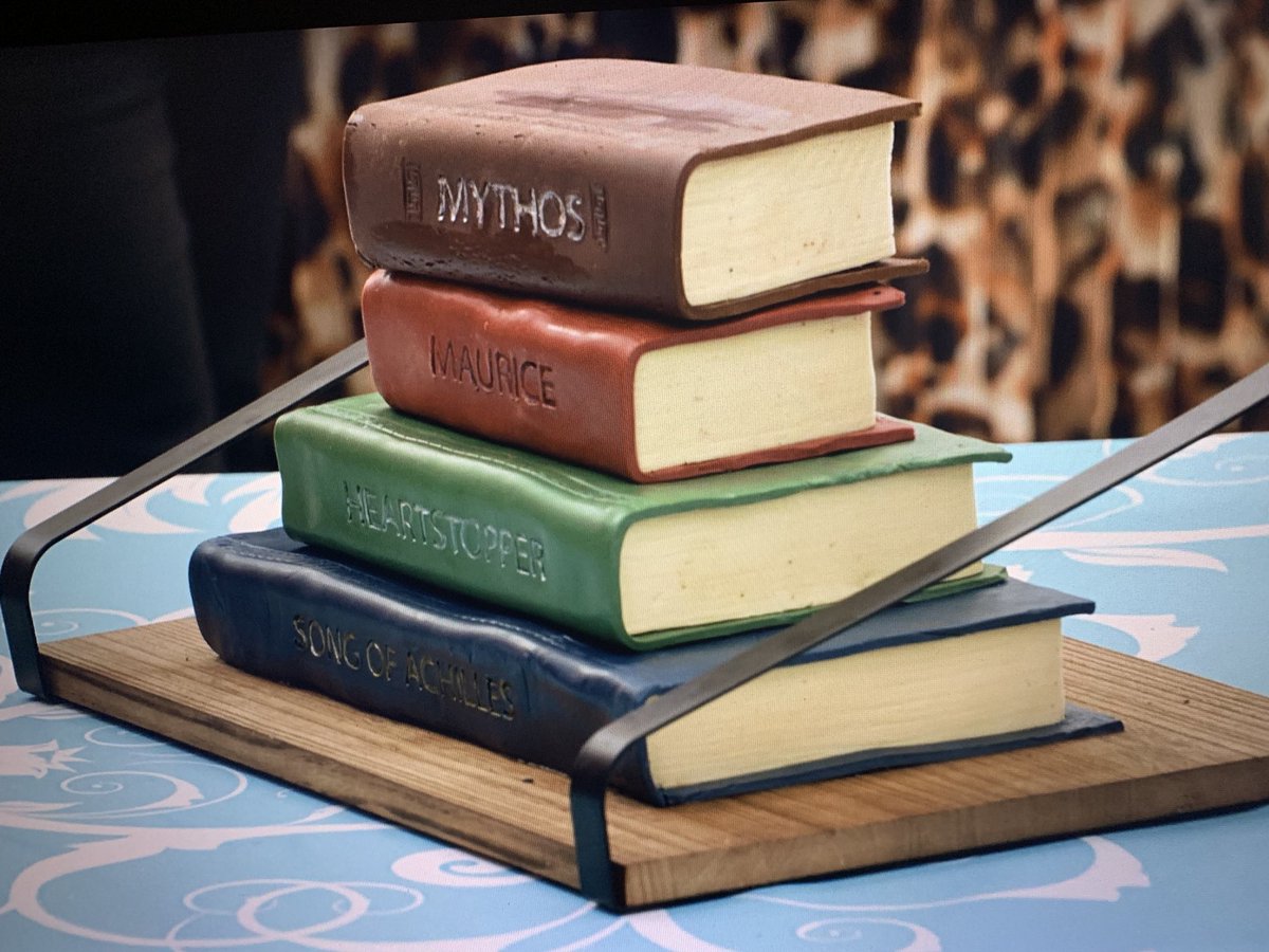 It would appear that Aziraphale and Crowley are undercover on this season of GBBO. A duck and a stack of books on the first episode? Also, now I really want a human AU of the two of them meeting on a baking show. Has anyone done that yet?