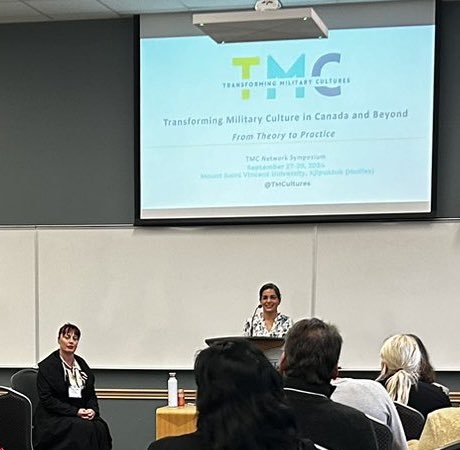 Nancy (@nancymltaber) on Twitter photo Dr. Maya Eichler of <a href="/TMCultures/">Transforming Military Cultures Network</a> begins with a land acknowledgement before introducing Mary Jane Wells <a href="/heroinetheplay/">mary jane wells</a> who will present on the Heroine Project and its powerful implications for military culture change in Canada. #TMCsymposim Dr. Maya Eichler of <a href="/TMCultures/">Transforming Military Cultures Network</a> begins with a land acknowledgement before introducing Mary Jane Wells <a href="/heroinetheplay/">mary jane wells</a> who will present on the Heroine Project and its powerful implications for military culture change in Canada. #TMCsymposim