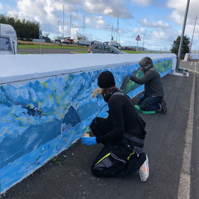 Fellow Creative Stranraer board members Leigh and Jennie working on a new mural at the harbour