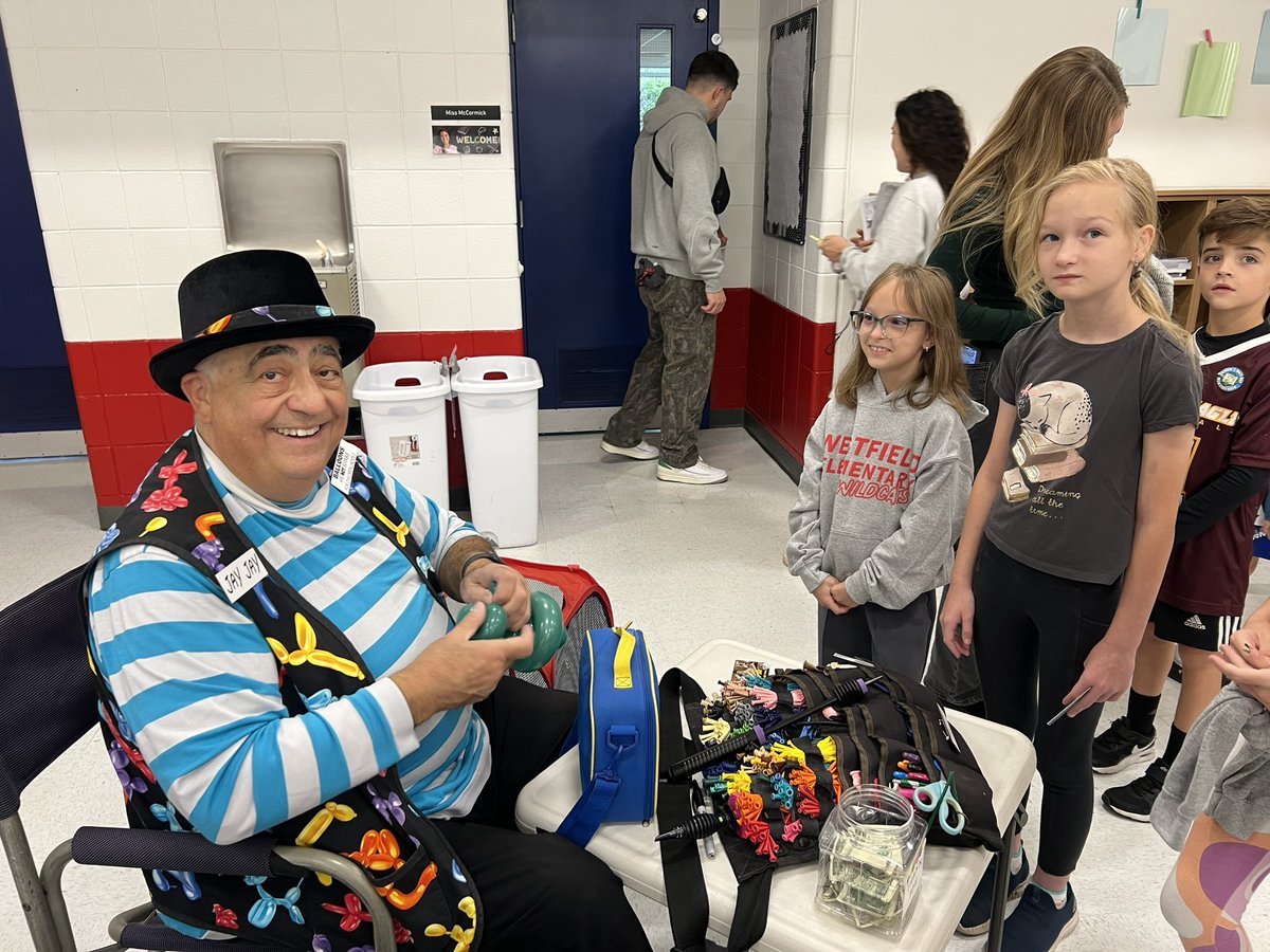Everyone is having fun at Westfield PTC’s Fall Fest today! Bouncy house, DJ, games, treats, balloon twisting, and pumpkin decorating are keeping everyone entertained despite the weather.