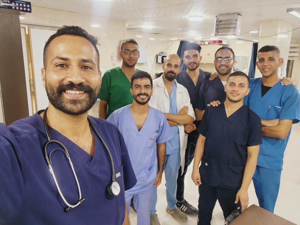 M7madNajar's tweet photo. Here stand the heroes of Al-Awda Hospital in Gaza ❤️  🇵🇸
Despite losing our homes, colleagues, and loved ones💔🇵🇸
we stand here for our wounded people.  
We fight to mend their scars, and though our hearts are heavy, we will never leave them❤️🇵🇸
We will never lose hope ❤️❤️ https://t.co/keWxLqFiJ6