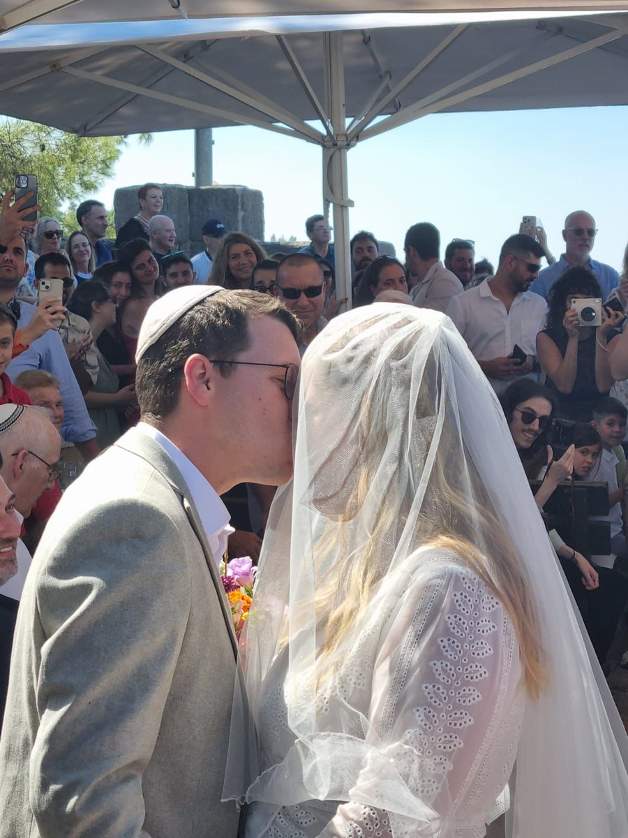 faniaoz's tweet photo. Yesterday afternoon, per the ancient Jewish tradition,  we walked with our elder son to the nuptial canopy - his brother held one of the posts - and saw him and his lovely bride exchange their oaths and become husband and wife.
In my heart I made my own oath: to do everything in my power that my future grandchildren grow up beloved, in a safe and democratic Israel, next door to a peaceful Palestine where other people’s grandchildren are loved and secure too.
Good night from Mount Carmel.