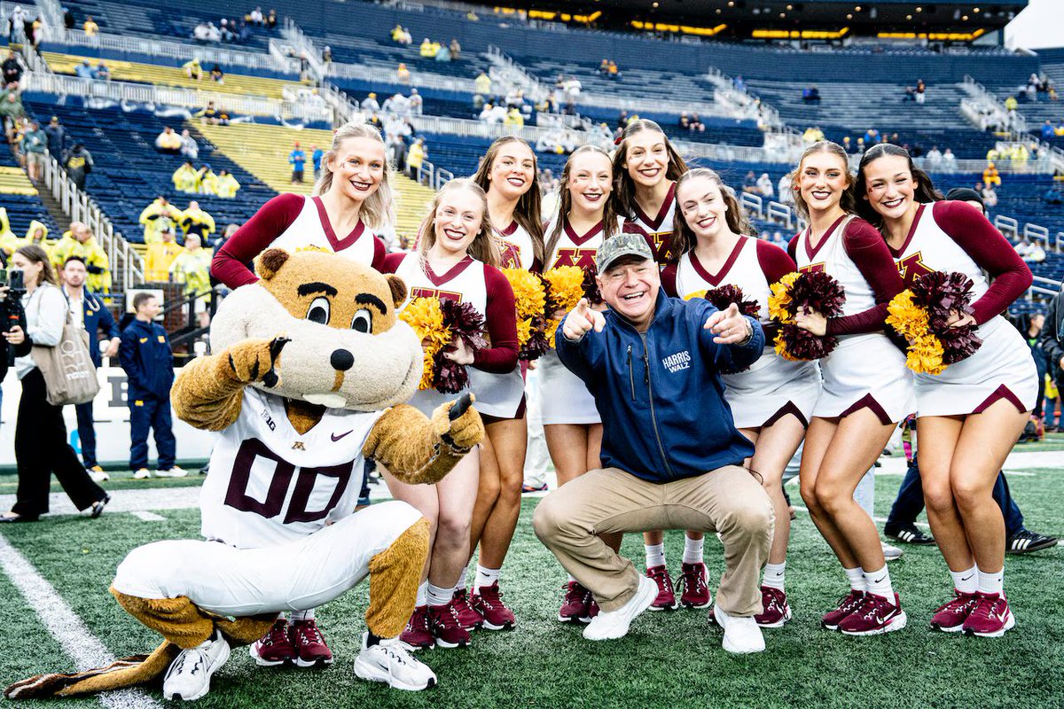 MarioNawfal's tweet photo. 🚨🇺🇸WALZ ATTENDS MICHIGAN-MINNESOTA GAME AHEAD OF TUESDAY'S DEBATE

Walz attended the Michigan-Minnesota football game, tailgating with fans and meeting Minnesota's coach before Tuesday’s debate against JD Vance, Trump’s running mate. 

Walz, leveraging his background as a football coach, has been rallying young voters with campus visits. 

After the game, Michigan, which defeated Walz's home state, Walz will head to northern Michigan for final debate prep.

Meanwhile, Kamala was fundraising in San Francisco, emphasizing the stakes of the 2024 election.

Source: AP