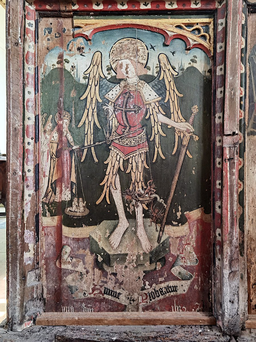 2/3 In the Christian tradition, Michael is associated with Judgement, impartially sorting the Saved and the Damned on the Last Day. On the early 16th Century screen at Wellingham, Norfolk, he holds a sword in his left hand and a set of balance scales in his right hand, in which