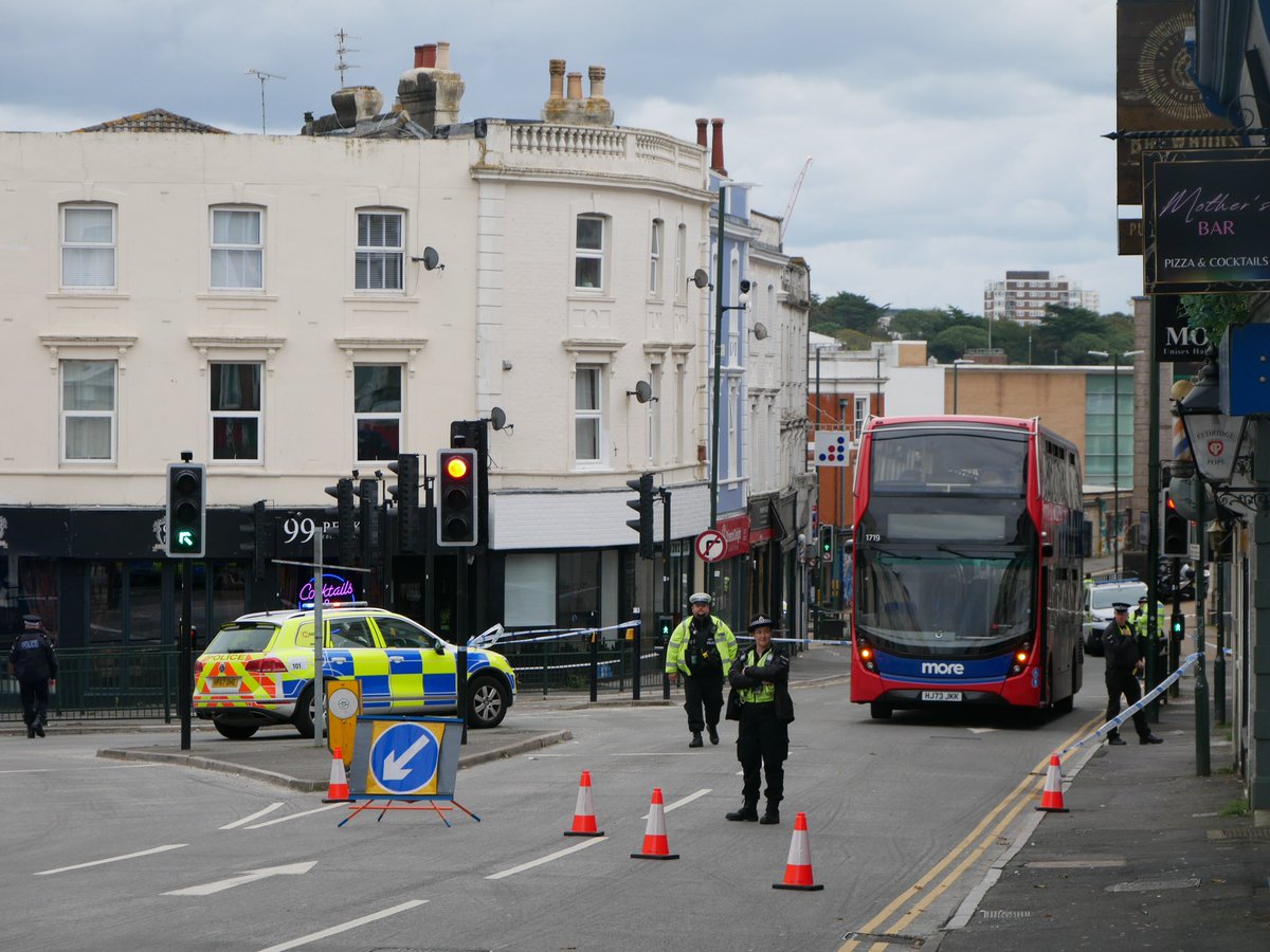 HamishBailey14's tweet photo. @dorsetpolice have partially cordoned off Commercial Road in the triangle with a @Morebusco bus also in the cordon. 

It is unknown why at this time. @Bournemouthecho 

#BCP https://t.co/ONU6W2YaFi