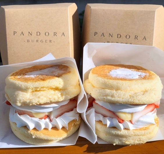 Fluffy pancake burgers with strawberries and cream