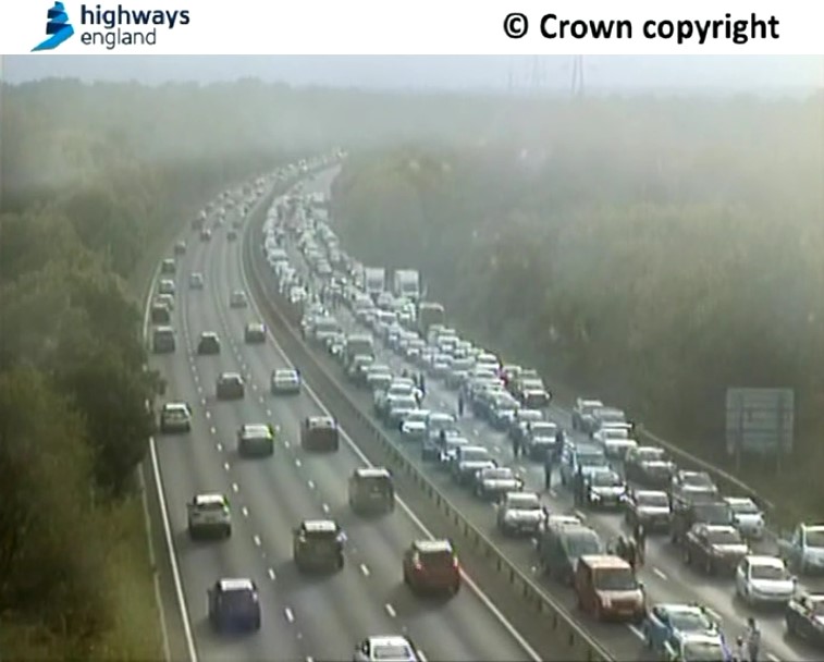 HighwaysSEAST's tweet photo. Traffic caught within the closure of the #A3 northbound between the #A247 (#Burntcommon) & the #B2039 (#Ockham) continues to be turned around from the back of the queue.
Please stay in your vehicle and do not use the closed road as a playground as we're observing on CCTV. https://t.co/rFARDvbyBg