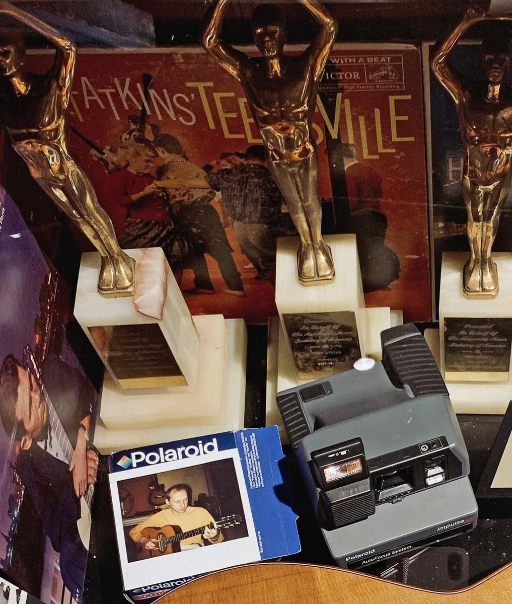 In 1990, the legendary Chet Atkins, an inductee of the MHOF, released an album with Mark Knopfler. 

This Polaroid Impulse One-Step Camera, along with an extra box of film and a photo of Mark, has sat on Chet's grand piano in his home studio since the day he captured the moment.