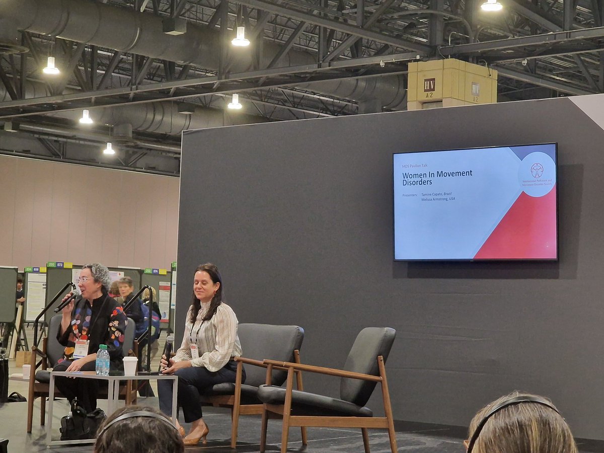 Melissa Armstrong and <a href="/tamine_capato/">Tamine Capato</a>, the Women in Movement Disorders SIG steering committee co-chairs, presenting our SIG's aims and mission in the MDS Pavilion at the #MDSCongress 💪🚺♀️