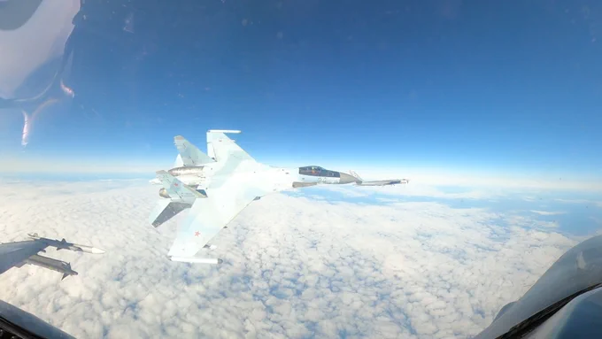 Photo of Russian Su-35 fighter conducting unsafe and unprofessional maneuver near a NORAD F-16 on Sept. 23, 2024.