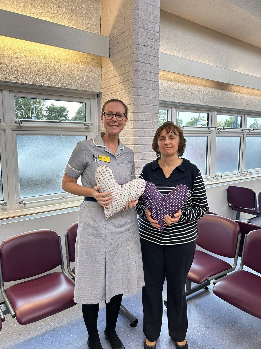 RWT_breastcare's tweet photo. Here I am accepting a very kind donation of heart shaped pillows from the lovely Helen. Her sister had also sent some over from France🇫🇷 We have found them to be useful to patients who have developed lymphoedema post surgery. Thank you both so very much💜 #breastcancersupport https://t.co/tUI9Gp1lBE