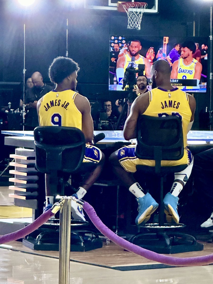 Rachel__Nichols's tweet photo. Never taken a media day pic like this before...and LeBron is not glossing over the moment. Asked if he’s thought about if it will be his last season, he said he hasn’t, noting that he’s just trying to appreciate this, and that being here with Bronny has given him “a lot of life.” https://t.co/oateT6aJg1