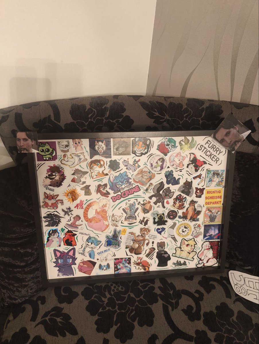 BoogieSp00kie's tweet photo. The stickers have been extracted from the bike and placed behind glass after their 900 Mile journey home from #Eurofurence #EF28 #furry https://t.co/R0jGYABrGE