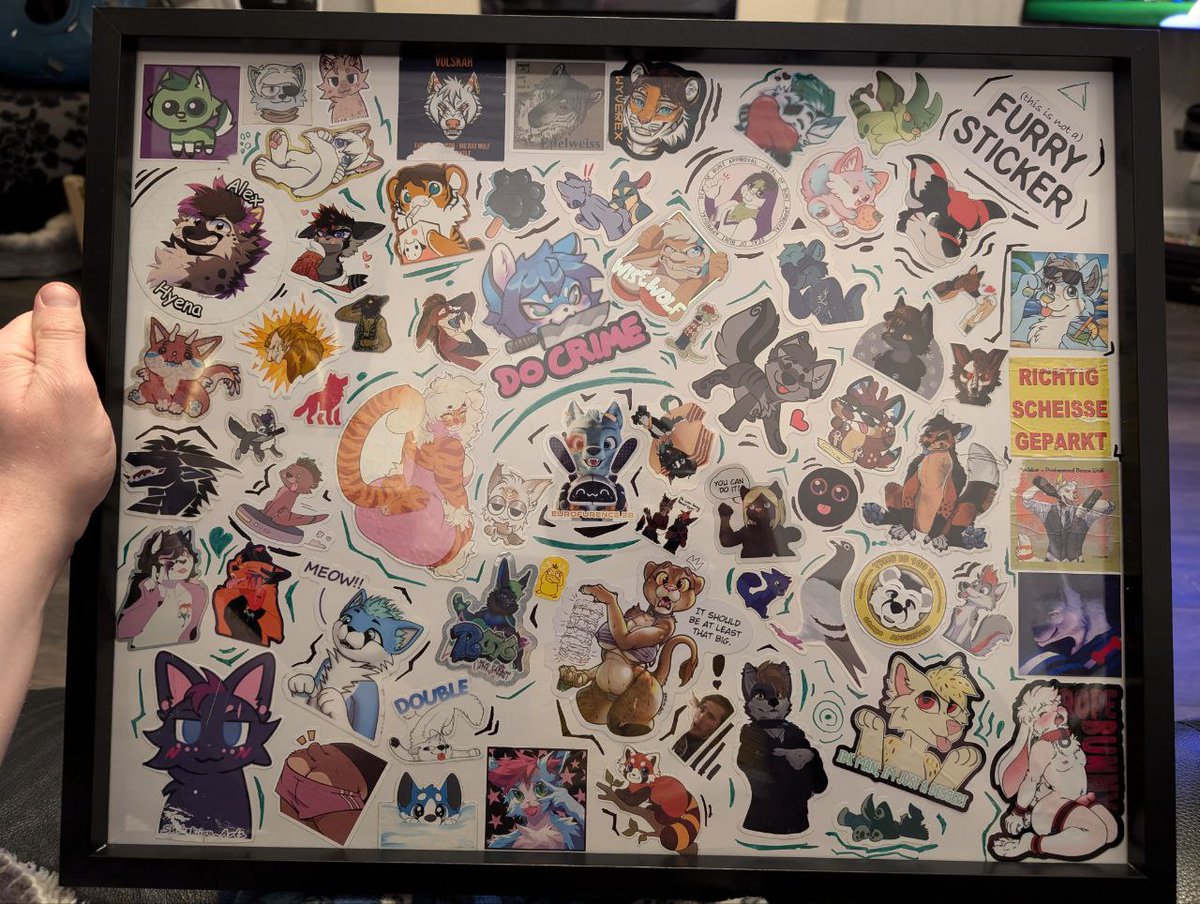 BoogieSp00kie's tweet photo. The stickers have been extracted from the bike and placed behind glass after their 900 Mile journey home from #Eurofurence #EF28 #furry https://t.co/R0jGYABrGE