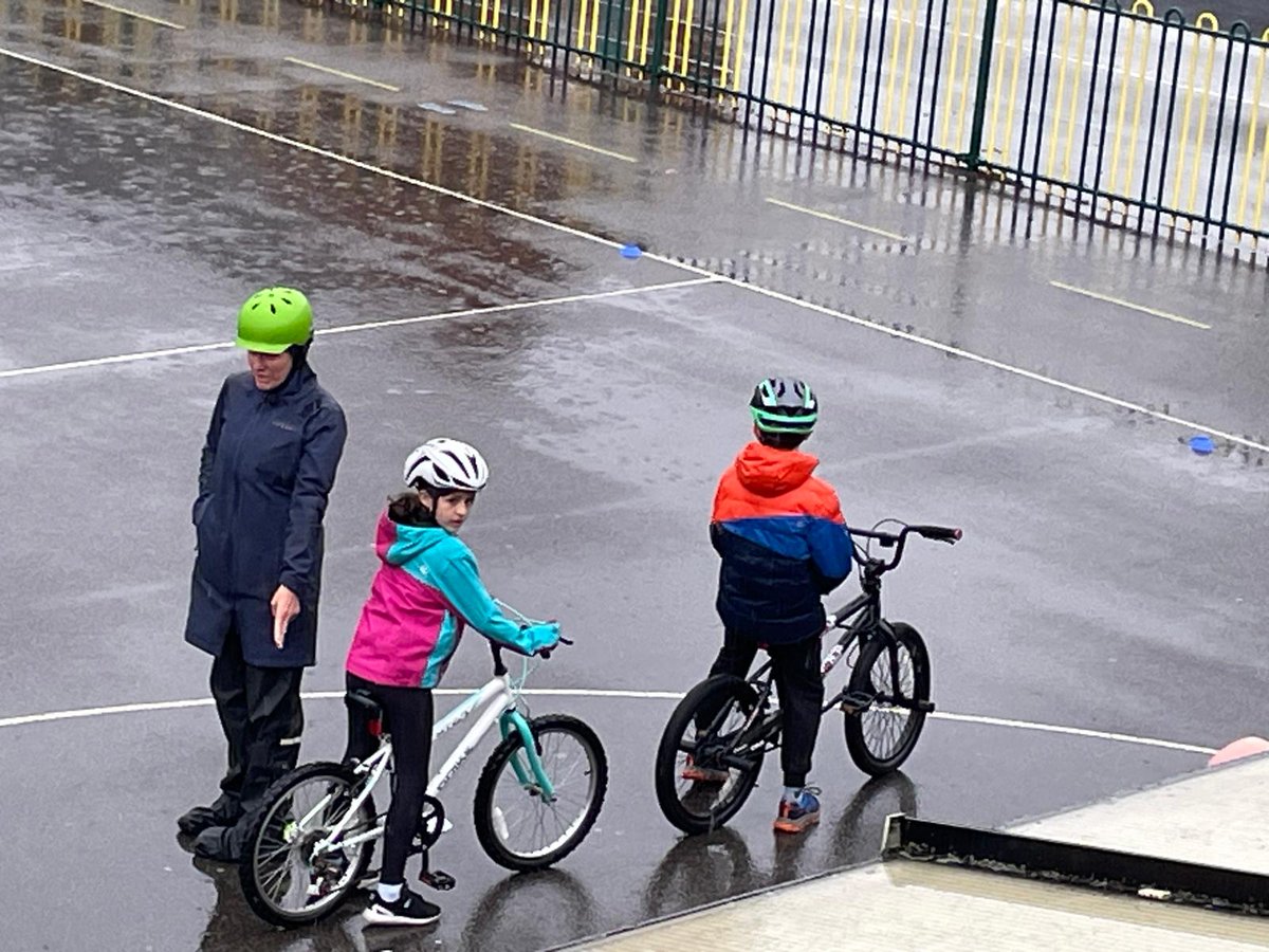 SLaurences's tweet image. Y5 braved the weather during their Bikeability session today! It was a very wet day!