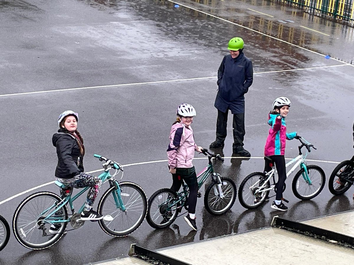 SLaurences's tweet image. Y5 braved the weather during their Bikeability session today! It was a very wet day!