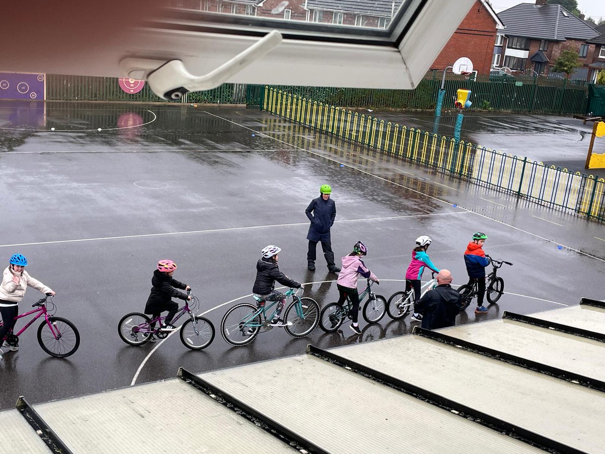 SLaurences's tweet image. Y5 braved the weather during their Bikeability session today! It was a very wet day!